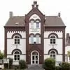 Informationskarte des CVJM-Hauses Haan mit Bild eines braunen Backsteingebäudes.
