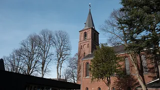Informationskarte der Evangelischen Kirche Haan mit modernem Kreuz-Logo.
